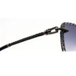 Closeup of twisted cable metal temple and chain buckle detail on women sunglasses